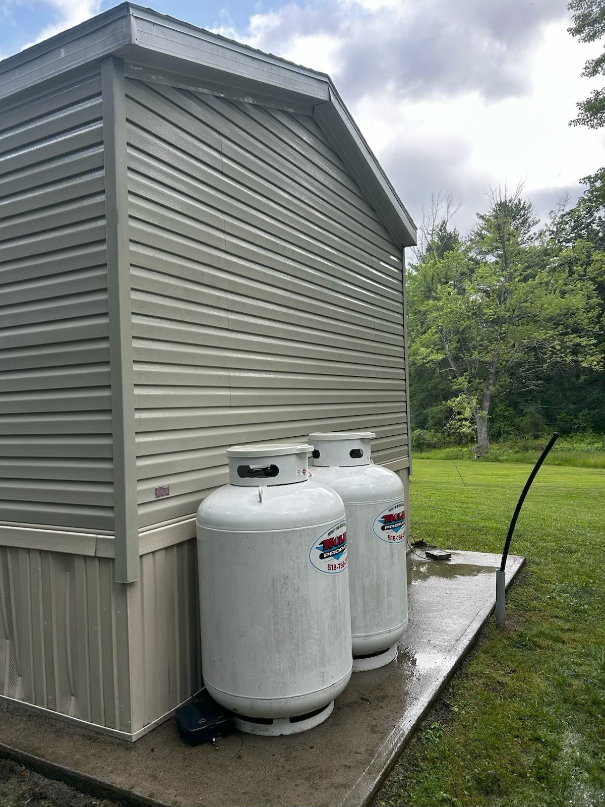 Clean propane tanks and siding after power washing